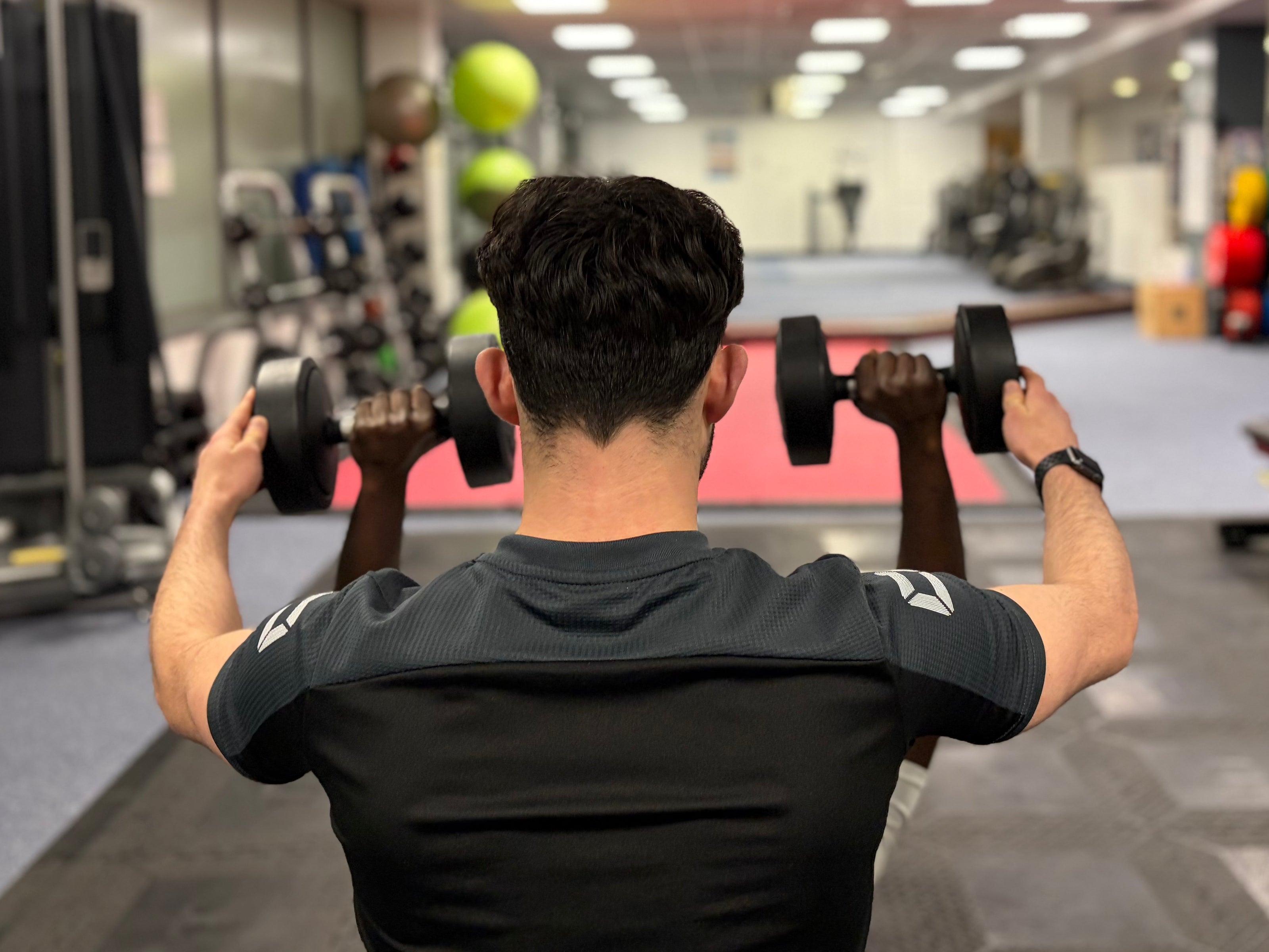 Pickett Coaching personal training, teaching a client correct form.